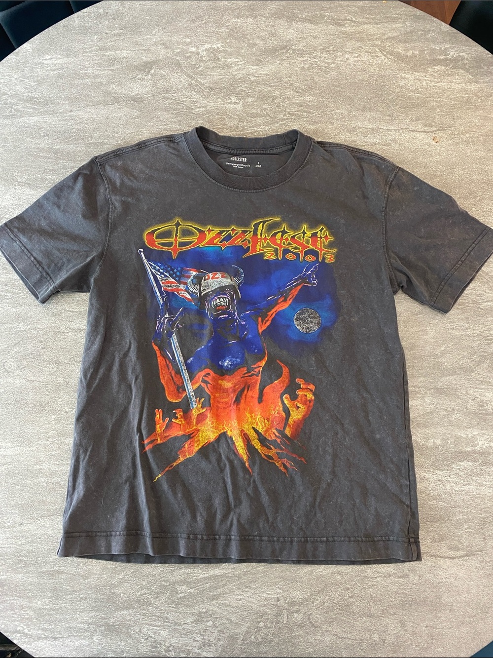 Hollister Black Graphic Tee with Blue Figure and Orange Flames